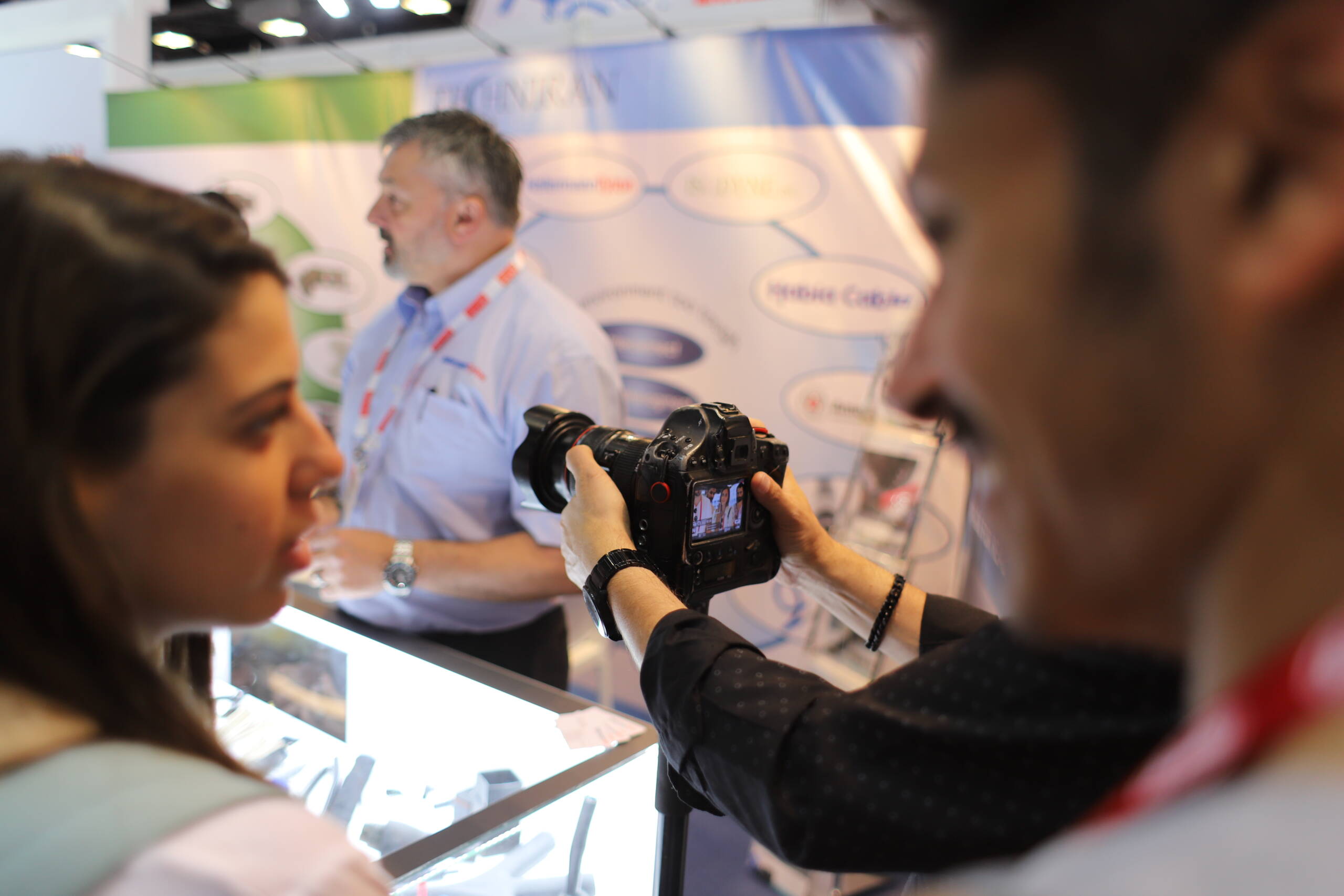 A photographer leans in to capture a detail